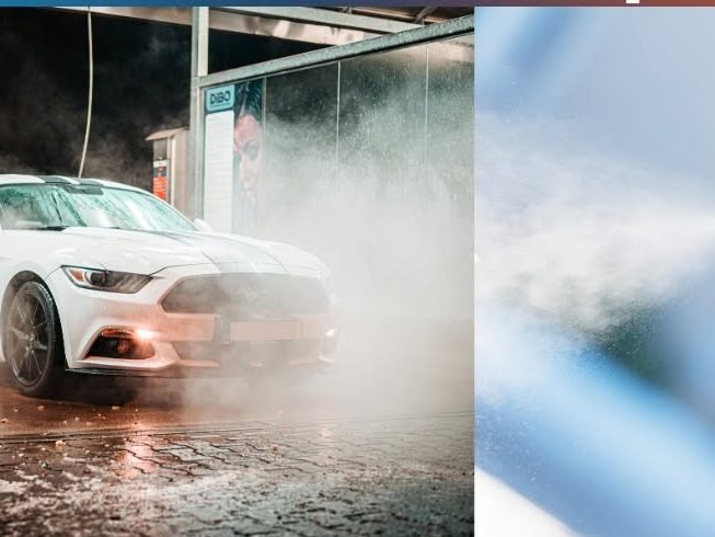 Spray gun applying automotive refinish paint in a bodyshop